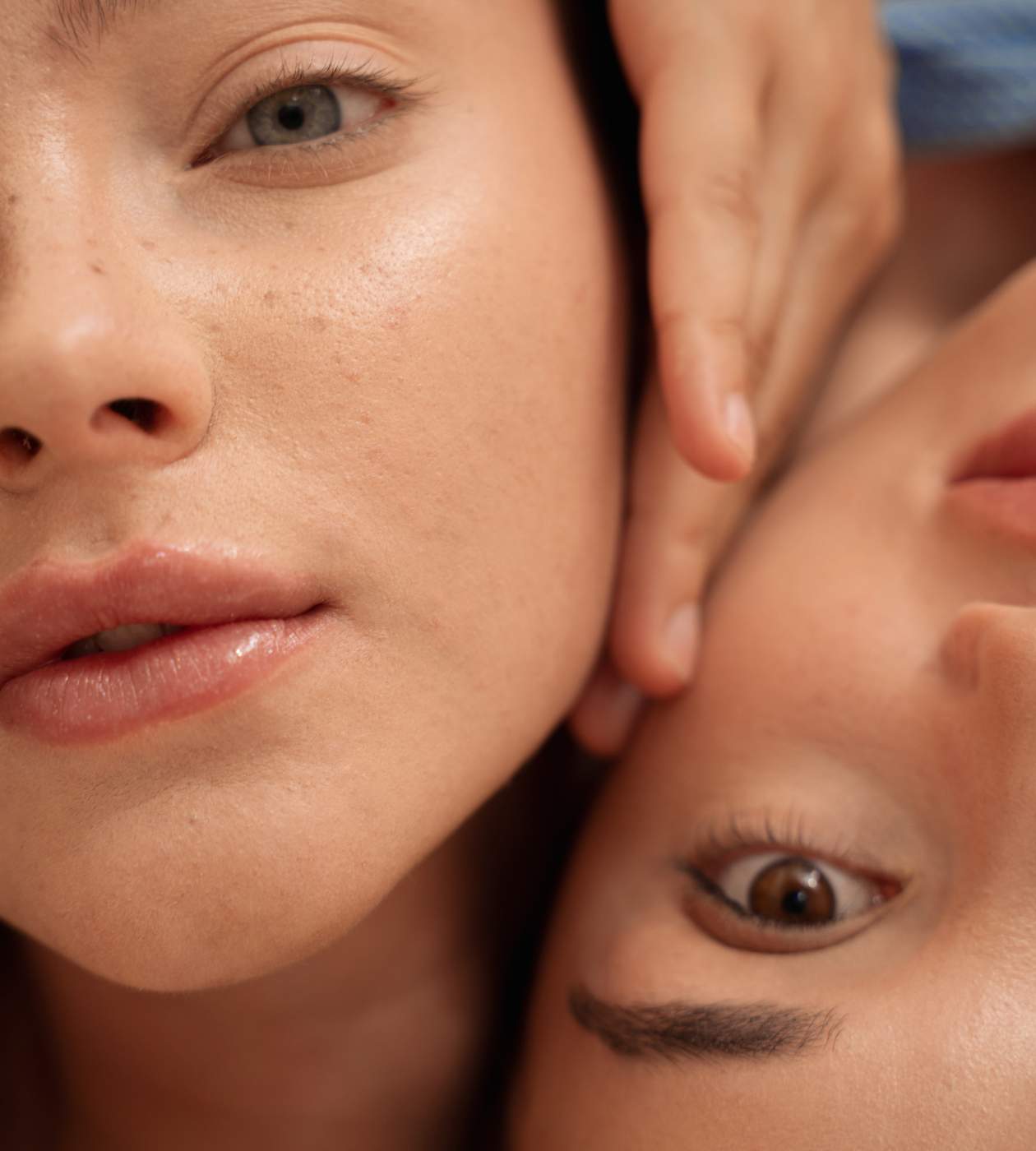two people holding faces together